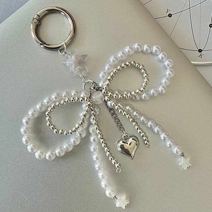 white and silver bow charm keychain